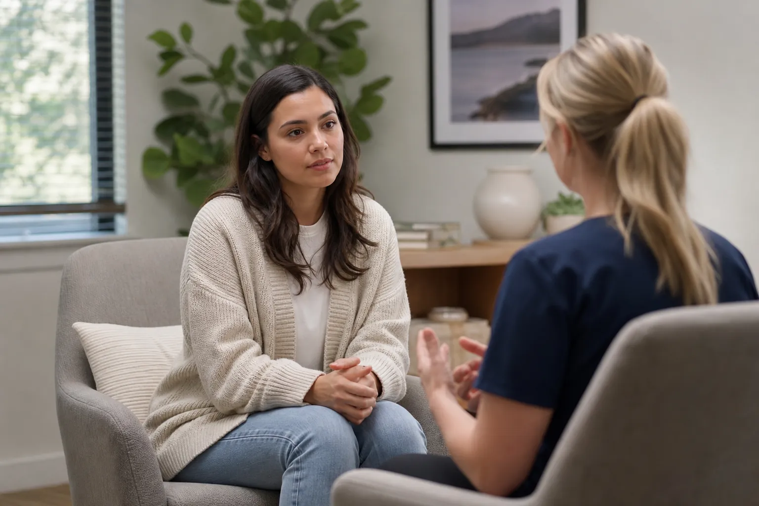 Patient Discussing Treatment With a Healthcare Professional A patient listens attentively as a healthcare professional explains treatment during a private consultation.