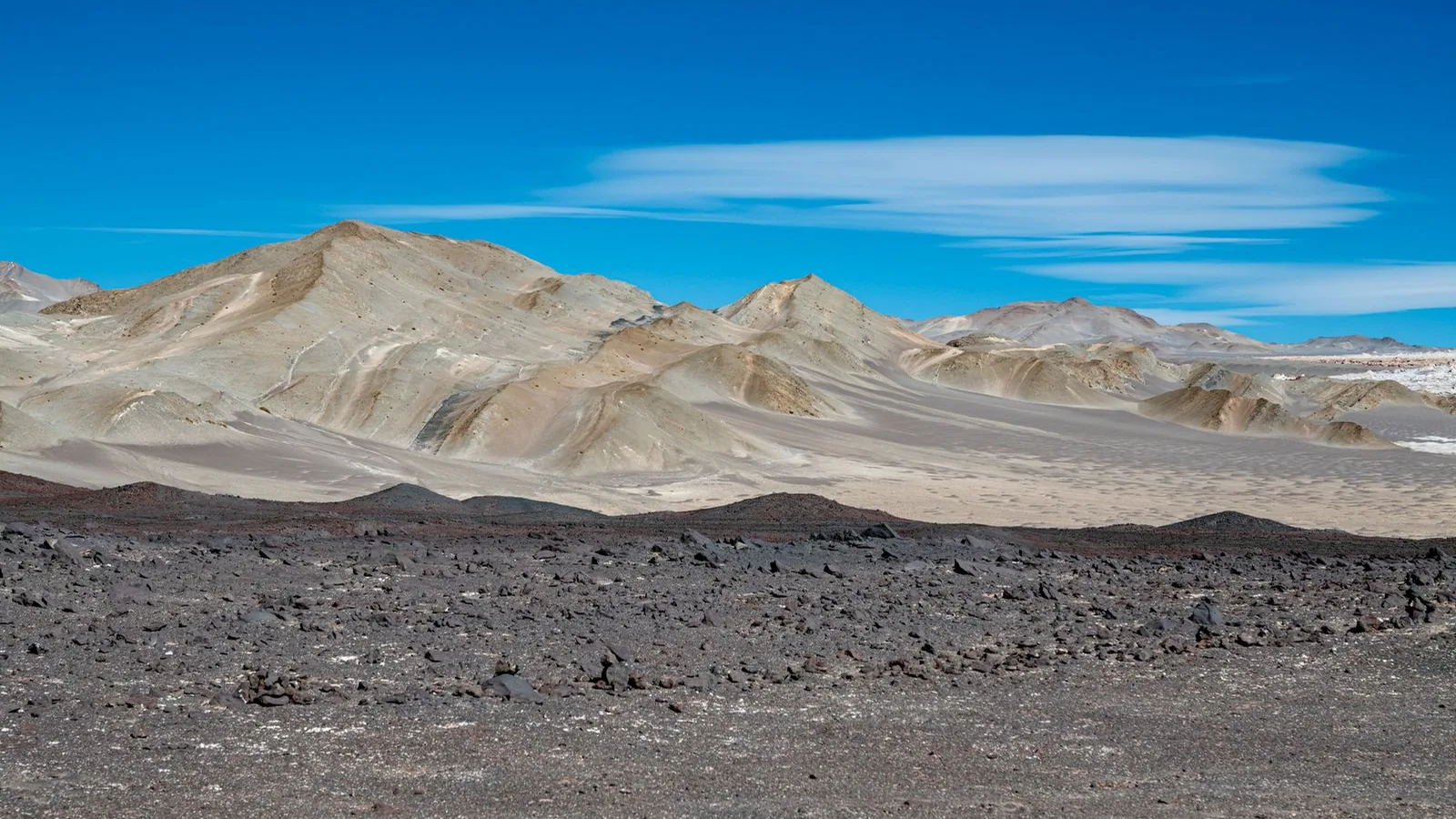 Barren mountains beneath a clear sky