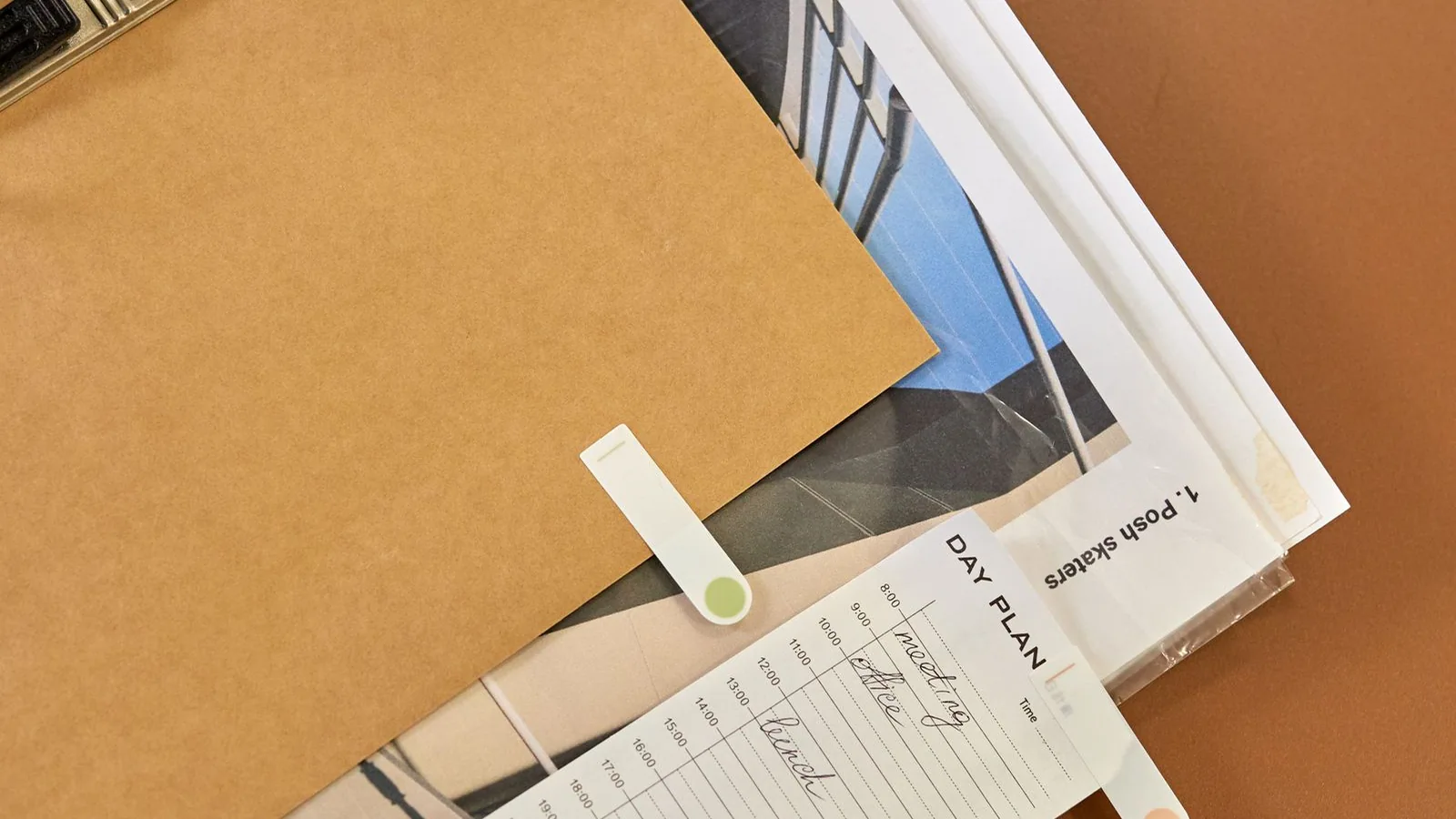 Planner, clipboard and papers on a desk