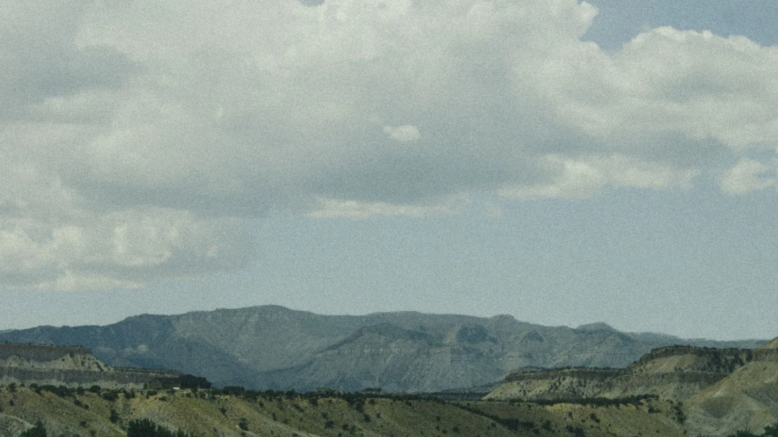 Open desert landscape beneath clouds Open desert landscape beneath clouds