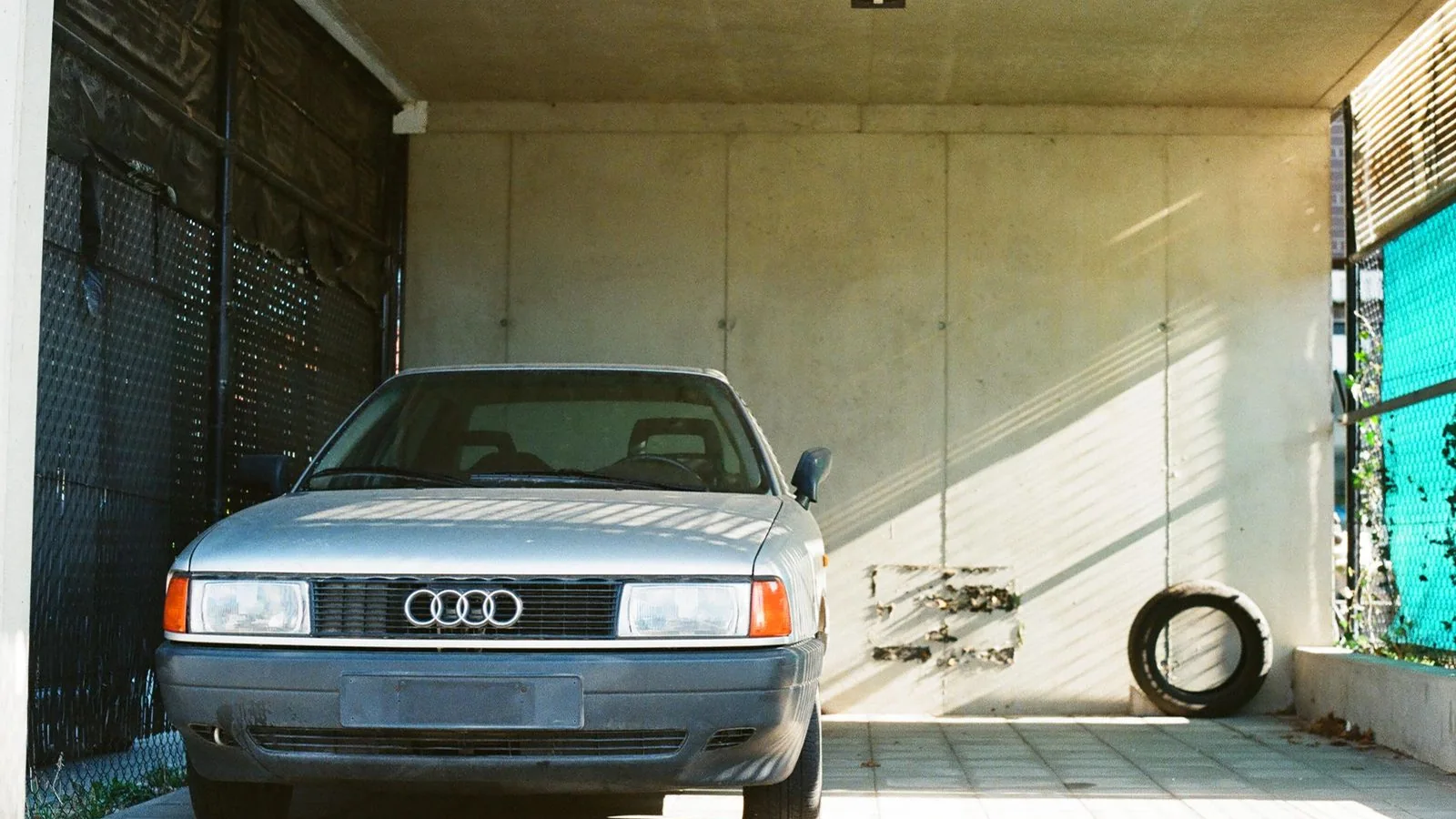 A classic car parked in a garage